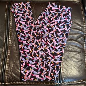 LulaRoe One Size Makeup lipstick leggings, black background, fits 2-10